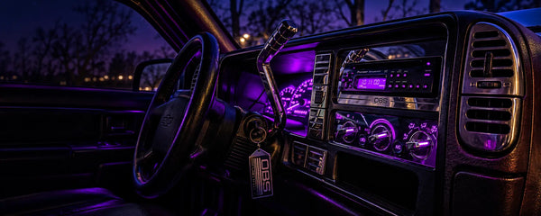 OBS Billet interior at night, showing a billet radio trim surround, polished billet controls and an aftermarket stereo in a G